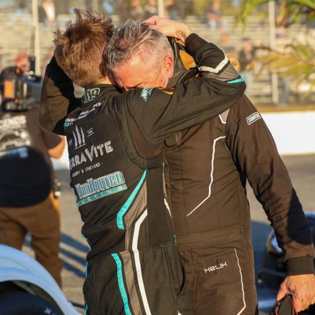 Chase and his father share a hug after Chase's victory at Riverhead Raceway while his grandfather was in the hospital.