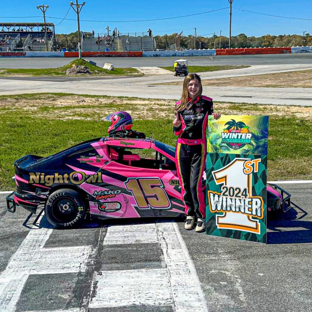 Rhylee Hutchins stands next to her Bandolero after her Round 3 victory during the 2024 Winter Nationals.