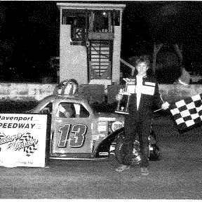 Pictured is Chris Springer with the green #13, Reyhall Racing Legends car with his first win at Davenport Speedway